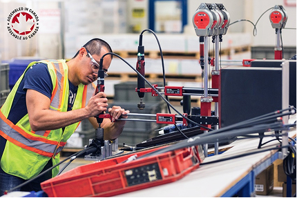 An employee working on the production line